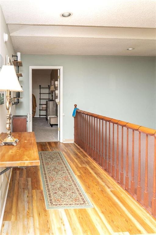 hall with dark wood-type flooring