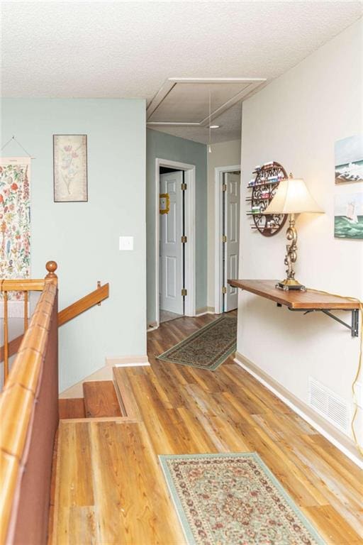 entrance foyer featuring hardwood / wood-style flooring and a textured ceiling