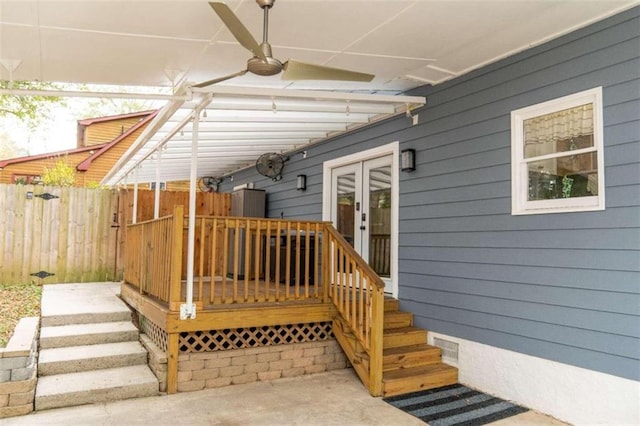 wooden terrace featuring ceiling fan and french doors