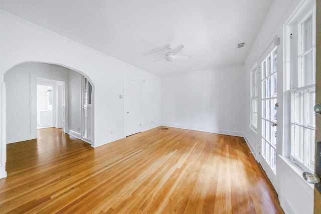 empty room with hardwood / wood-style flooring and ceiling fan