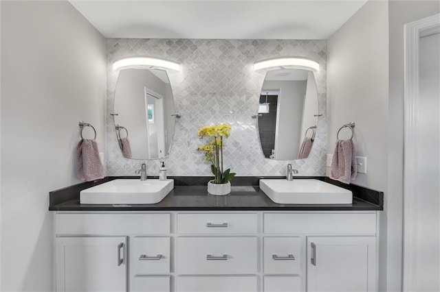 bathroom featuring vanity and decorative backsplash