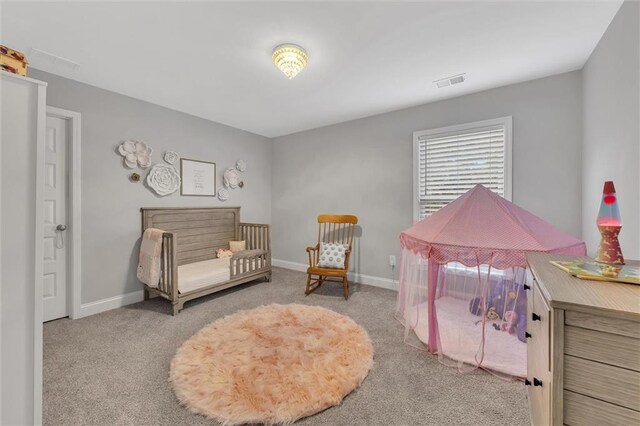 sitting room featuring light colored carpet