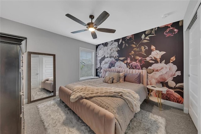 bedroom featuring light carpet and ceiling fan