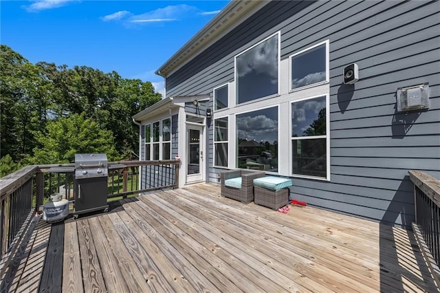 wooden terrace with a grill