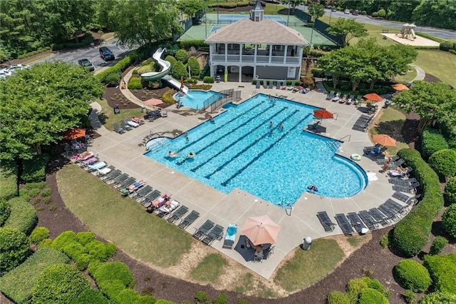 view of swimming pool featuring a patio area and a water slide