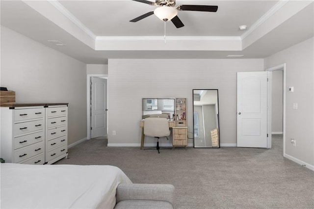 carpeted bedroom featuring crown molding, ceiling fan, and a tray ceiling