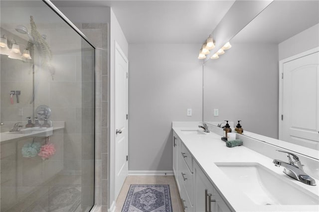 bathroom featuring vanity, tile patterned floors, and walk in shower