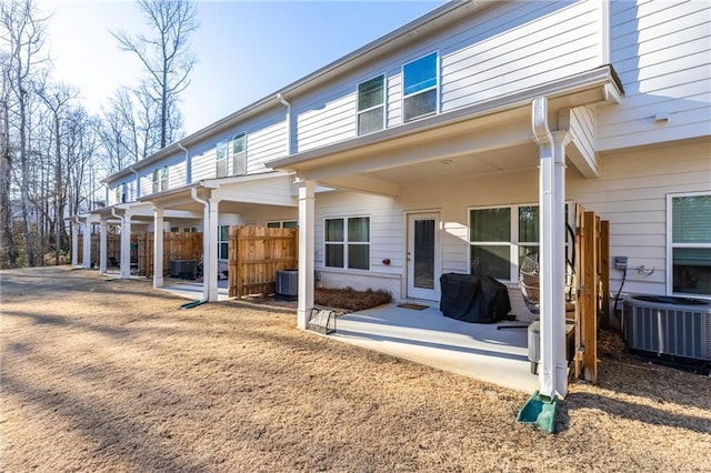 back of house with central AC and a patio area