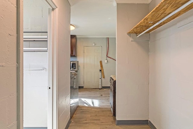 hallway with light hardwood / wood-style flooring