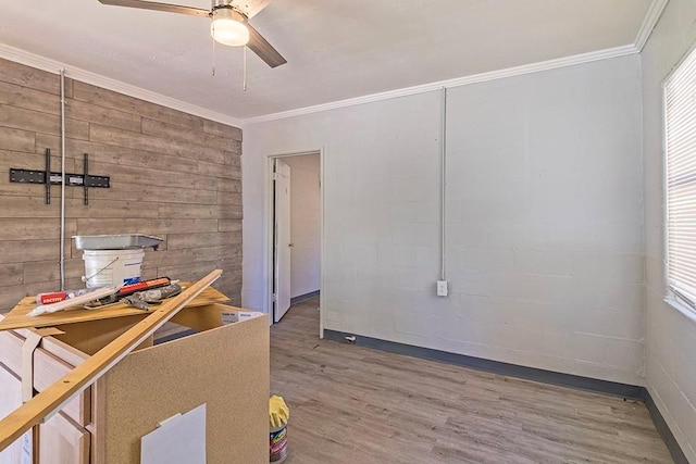 interior space with crown molding and hardwood / wood-style flooring