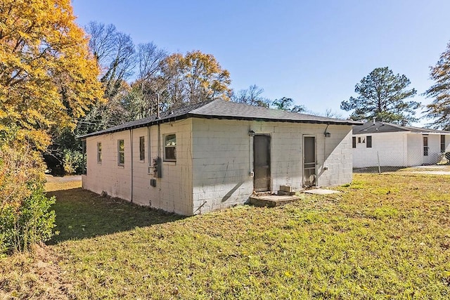 view of outdoor structure with a lawn