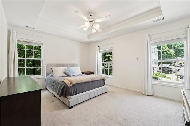 350 Eagle Tiff Dr, Sugar Hill, GA 30518 - bedroom with a raised ceiling, multiple windows, light carpet, and a ceiling fan