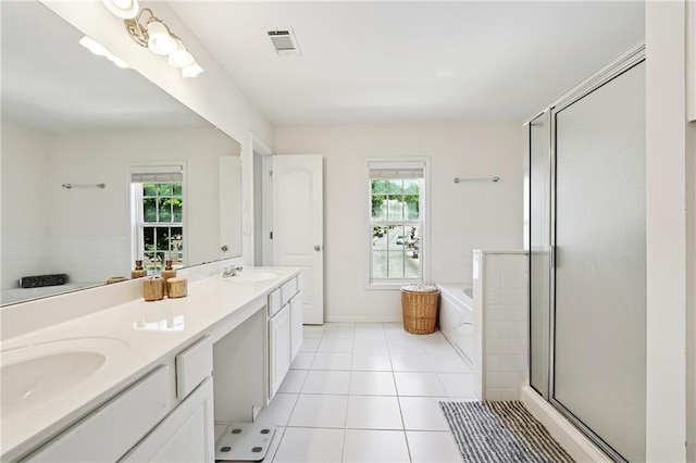 350 Eagle Tiff Dr, Sugar Hill, GA 30518 - bathroom with double vanity, a stall shower, a garden tub, and tile patterned floors