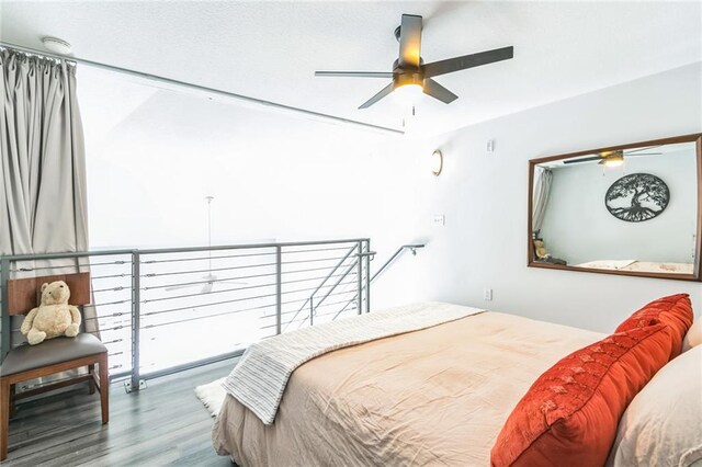 bedroom featuring wood-type flooring and ceiling fan