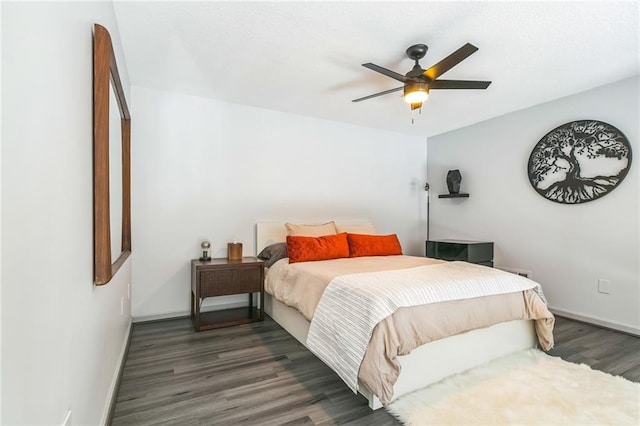 bedroom featuring dark hardwood / wood-style floors and ceiling fan