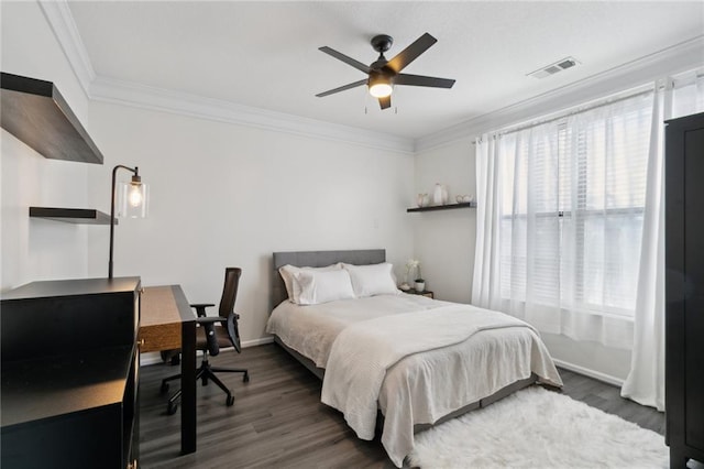 bedroom featuring ceiling fan, crown molding, and dark hardwood / wood-style flooring