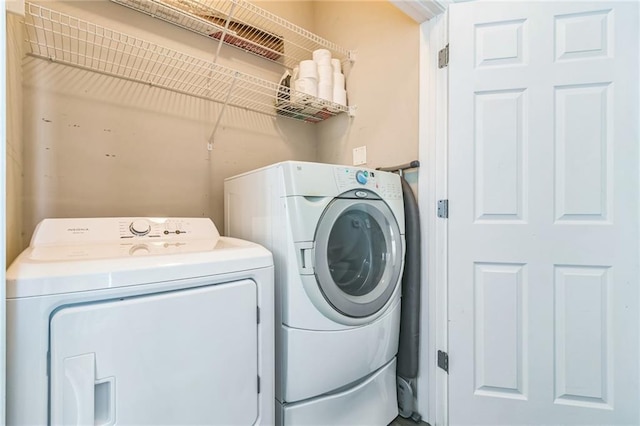 laundry room with independent washer and dryer