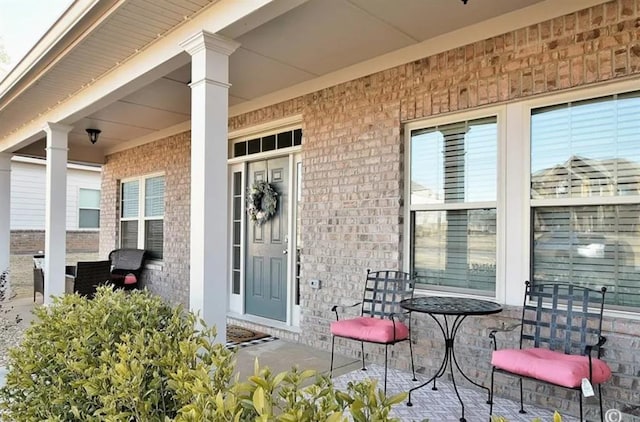 doorway to property with covered porch