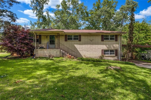 14300 Veterans Memorial Hwy, Villa Rica, GA 30180 - view of front of home with brick siding, a carport, and a front lawn