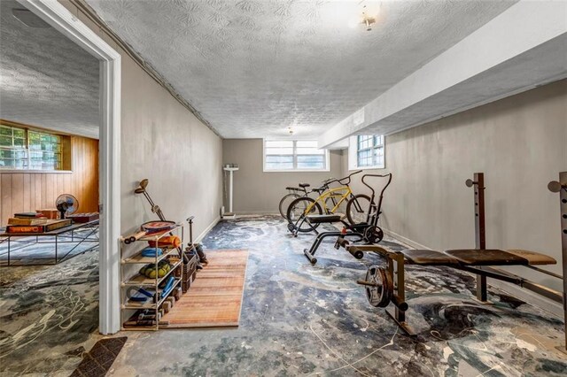 14300 Veterans Memorial Hwy, Villa Rica, GA 30180 - workout room with a textured ceiling and baseboards