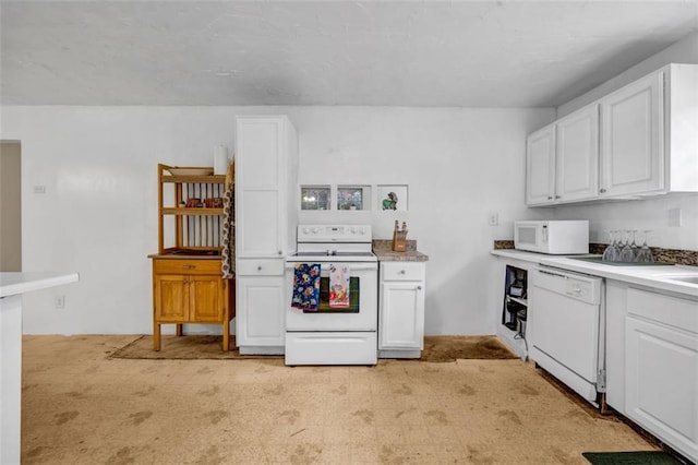 14300 Veterans Memorial Hwy, Villa Rica, GA 30180 - kitchen featuring white appliances, white cabinets, and light countertops
