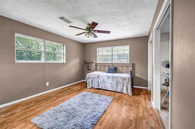 14300 Veterans Memorial Hwy, Villa Rica, GA 30180 - bedroom featuring wood finished floors, baseboards, and ceiling fan