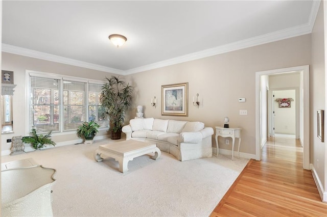 living room with hardwood / wood-style flooring and crown molding