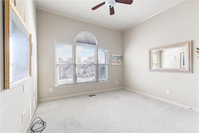 carpeted empty room featuring crown molding and ceiling fan