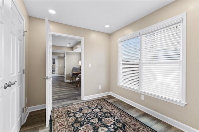 entrance foyer with dark hardwood / wood-style floors