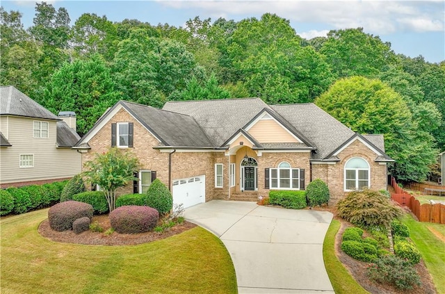 view of property with a front lawn and a garage