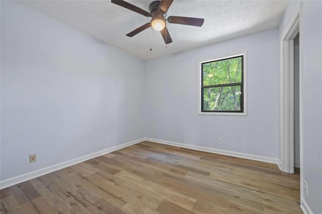 unfurnished room featuring light wood-type flooring, a textured ceiling, and ceiling fan