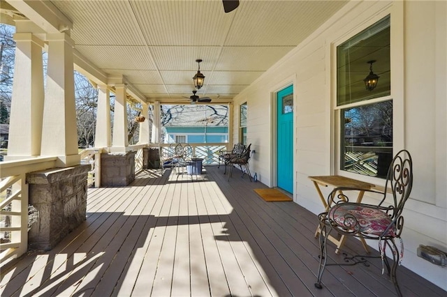 deck featuring ceiling fan and a porch