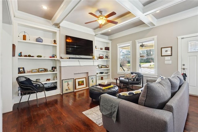 living room featuring coffered ceiling, dark wood-type flooring, built in features, ornamental molding, and beamed ceiling