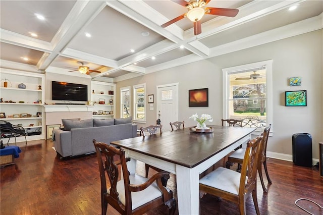 dining space with beam ceiling, dark hardwood / wood-style floors, a wealth of natural light, and coffered ceiling