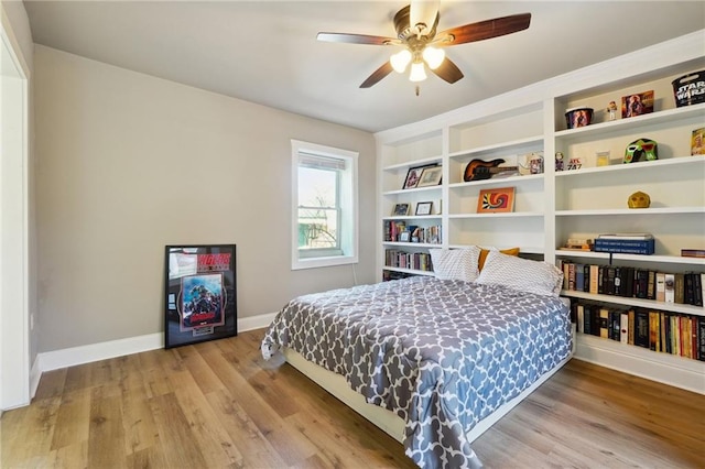 bedroom with ceiling fan and light wood-type flooring