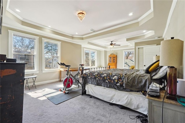 bedroom featuring carpet floors, ceiling fan, ornamental molding, and a raised ceiling