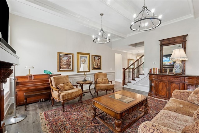 1656 Talking Rock Rd, Jasper, GA 30143 - living room featuring a chandelier, wood finished floors, stairs, crown molding, and wainscoting