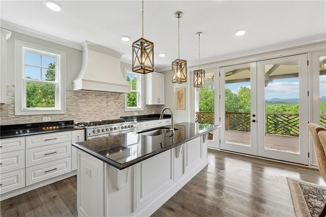 1656 Talking Rock Rd, Jasper, GA 30143 - kitchen with a sink, custom exhaust hood, dark countertops, high end stainless steel range oven, and backsplash