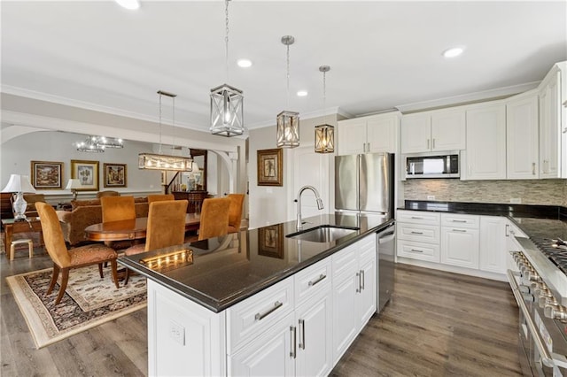 1656 Talking Rock Rd, Jasper, GA 30143 - kitchen featuring a sink, stainless steel appliances, ornamental molding, dark wood-style flooring, and backsplash