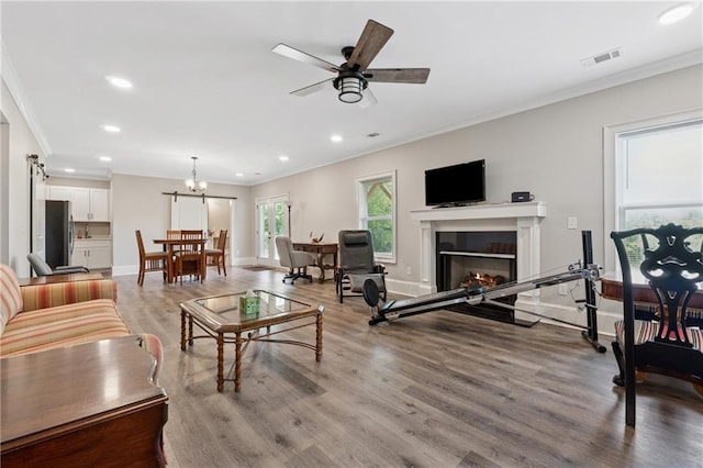 1656 Talking Rock Rd, Jasper, GA 30143 - living area with crown molding, wood finished floors, recessed lighting, baseboards, and a lit fireplace