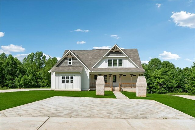 1656 Talking Rock Rd, Jasper, GA 30143 - view of front of home featuring board and batten siding, a porch, and a front lawn