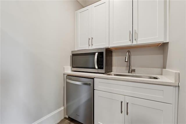1656 Talking Rock Rd, Jasper, GA 30143 - bar featuring stainless steel appliances, a sink, and baseboards
