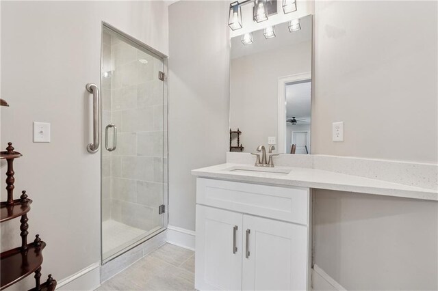 1656 Talking Rock Rd, Jasper, GA 30143 - bathroom with a shower stall, a ceiling fan, vanity, tile patterned floors, and baseboards