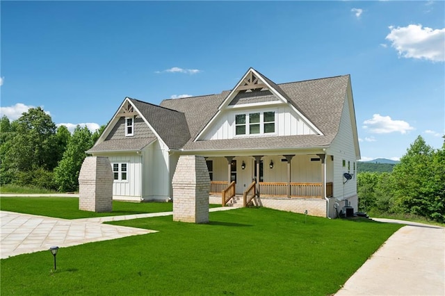 1656 Talking Rock Rd, Jasper, GA 30143 - view of front of property featuring board and batten siding, a porch, a front yard, and roof with shingles