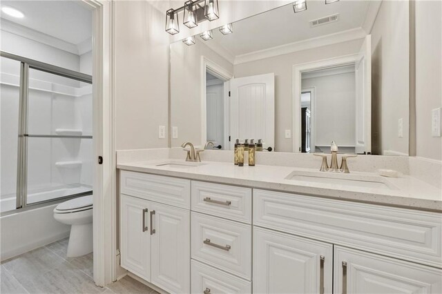 1656 Talking Rock Rd, Jasper, GA 30143 - bathroom with toilet, crown molding, double vanity, and bath / shower combo with glass door