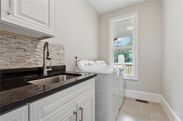 1656 Talking Rock Rd, Jasper, GA 30143 - laundry area with washing machine and dryer, light tile patterned floors, cabinet space, and baseboards