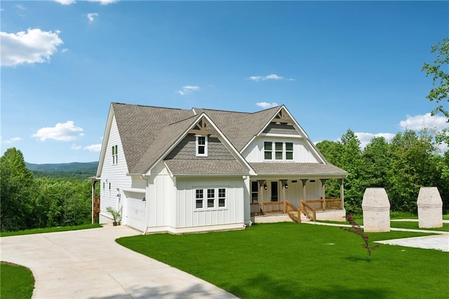 1656 Talking Rock Rd, Jasper, GA 30143 - view of front of home with board and batten siding, covered porch, driveway, a front lawn, and a shingled roof