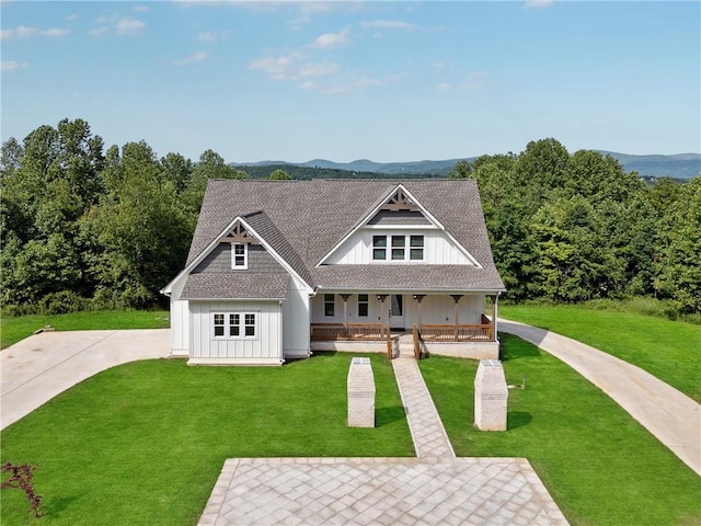 1656 Talking Rock Rd, Jasper, GA 30143 - view of front facade featuring board and batten siding, a porch, a front lawn, and roof with shingles