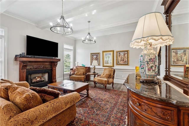 1656 Talking Rock Rd, Jasper, GA 30143 - living room with a chandelier, wood finished floors, a lit fireplace, beam ceiling, and crown molding