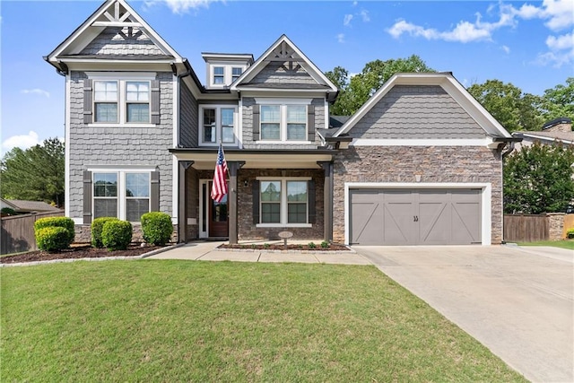 427 Dawson Pointe Pkwy, Dawsonville, GA 30534 - craftsman inspired home with concrete driveway, stone siding, and a garage